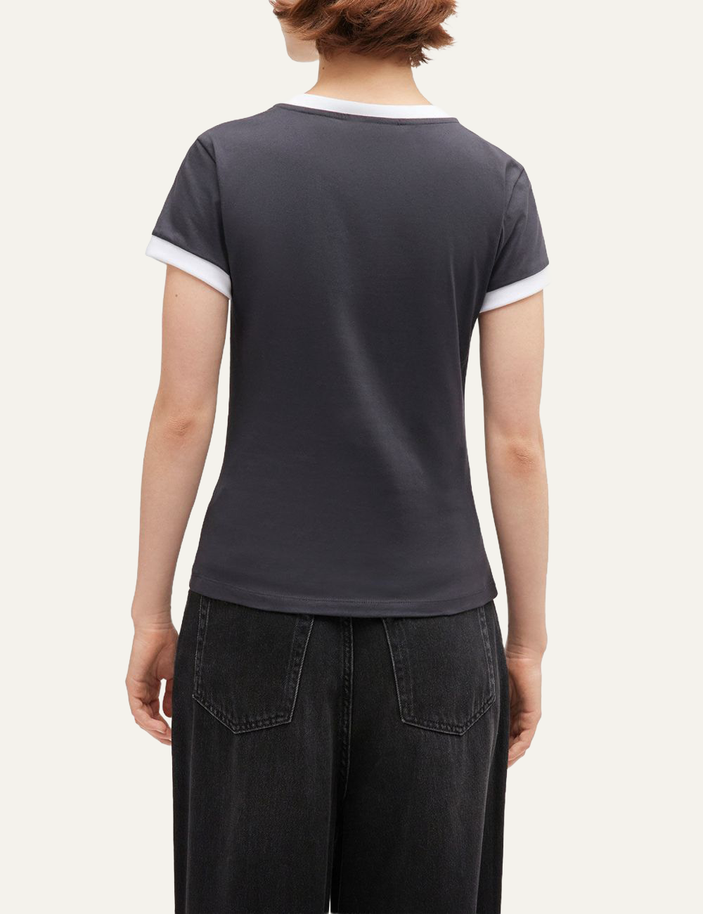 Back view of black Ganni fitted T-shirt with contrast white sleeve cuffs.