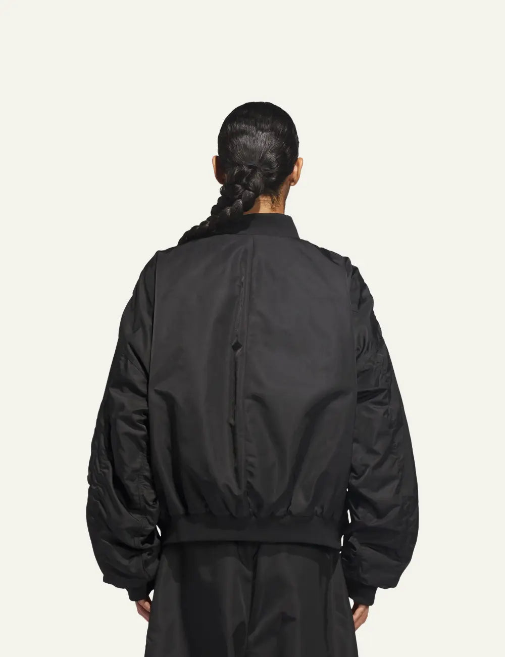 Πίσω όψη του Adidas x Willy Chavarria satin bomber jacket σε total black style