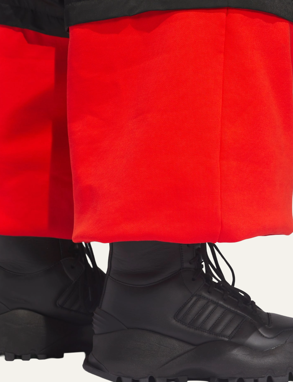 Close-up of lower fleece panel and hem on Adidas x Willy Chavarria track pants.