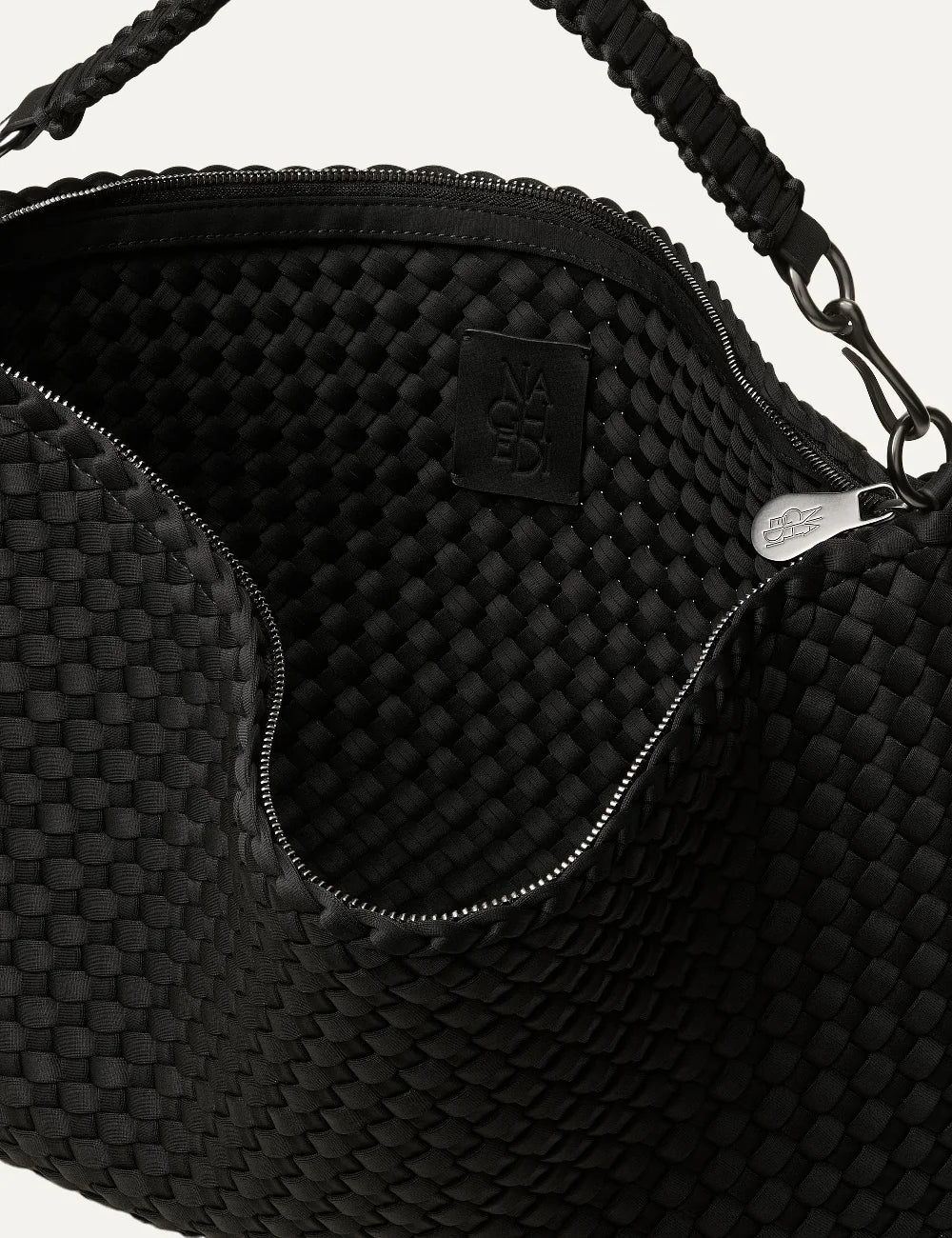Women's Naghedi Porto Medium Half-Moon Bag in true black handwoven neoprene with shoulder strap interior and logo patch