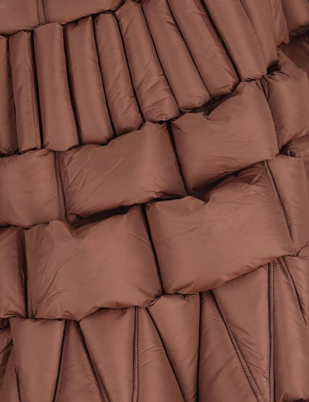 Raxxy 3D quilted texture close-up, με geometric padded panels και volumetric construction.