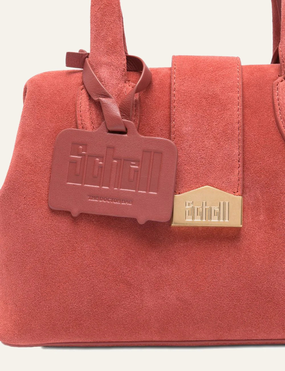 SCHELL logo plaque and detachable tag detail red suede bag