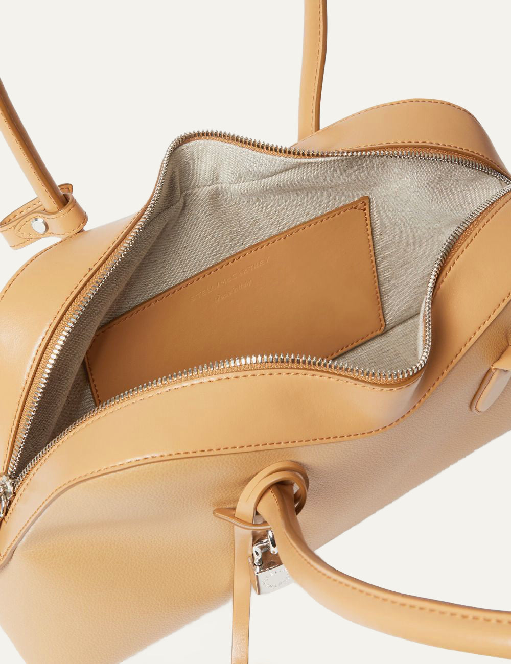 Stella McCartney Ryder bag top view honey vegan leather zip opening and handles