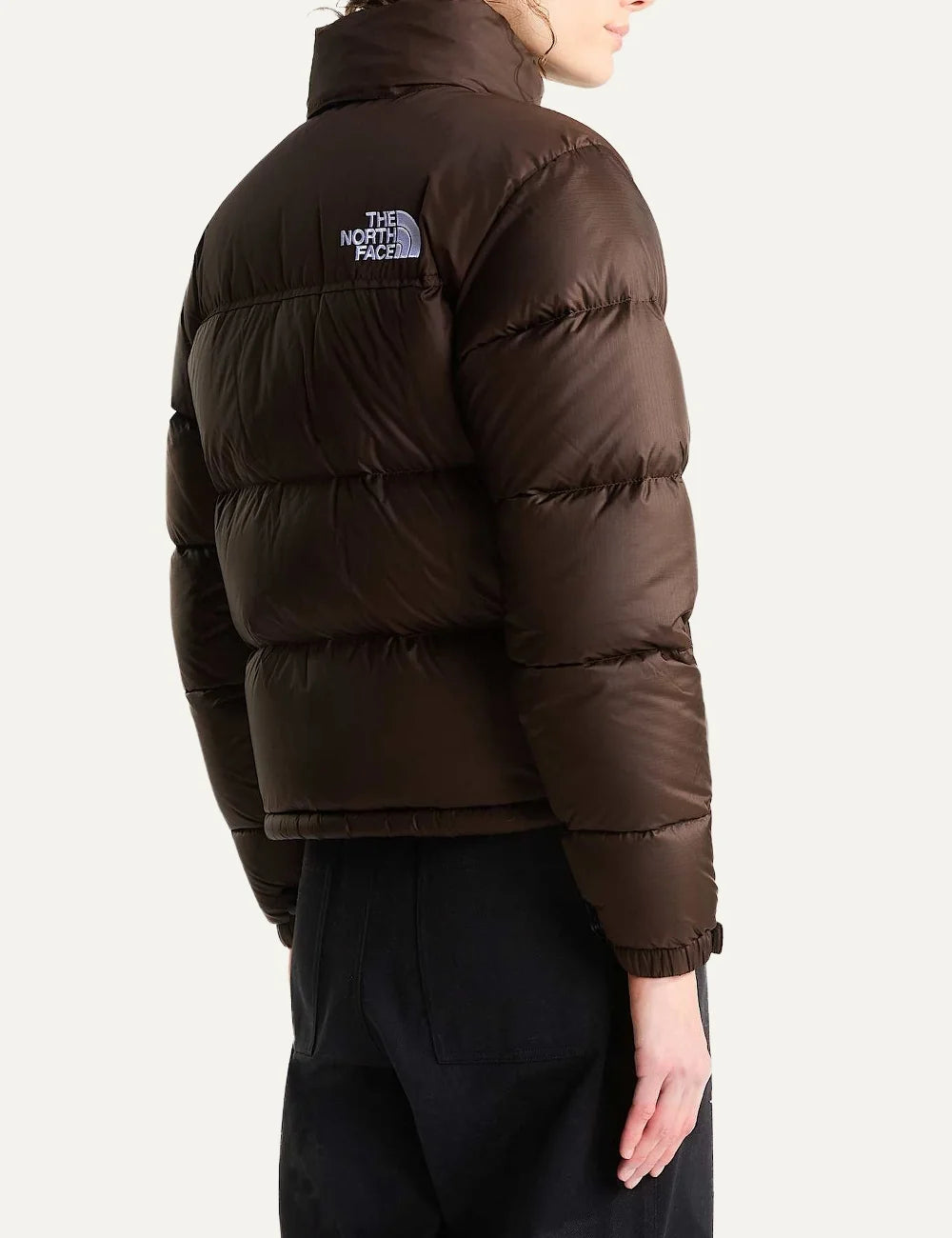 The North Face women's 1996 Retro Nuptse puffer jacket in dark chestnut brown with quilted down panels, high collar, front zip and white chest logo back