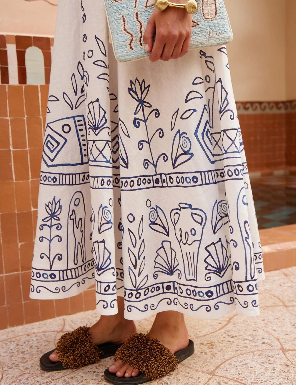 Alemais white linen midi dress hem embroidery detail