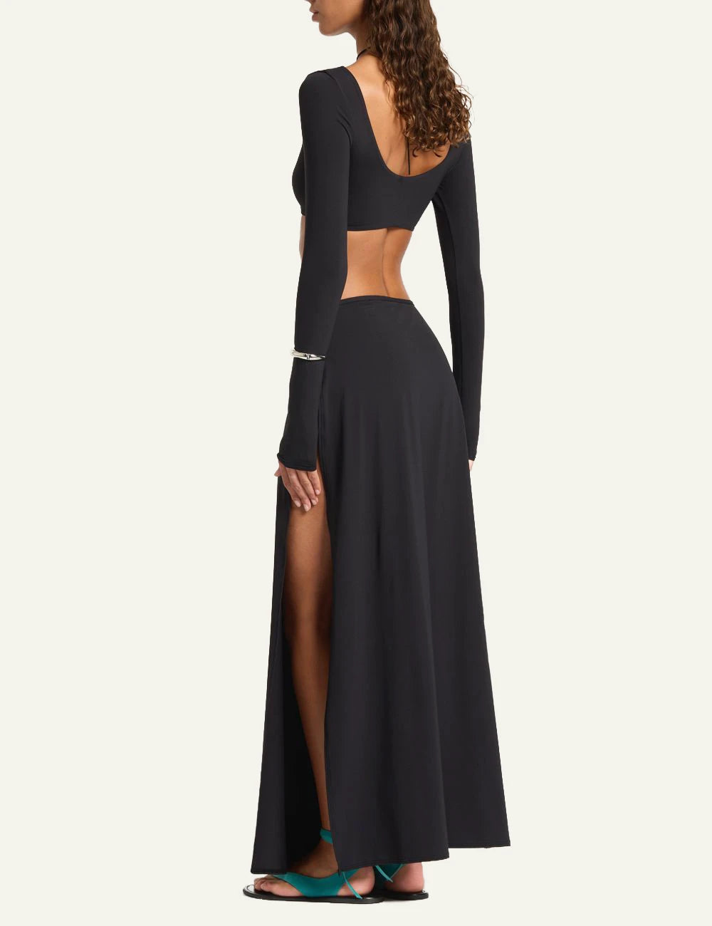 Bound black maxi skirt high slit back view