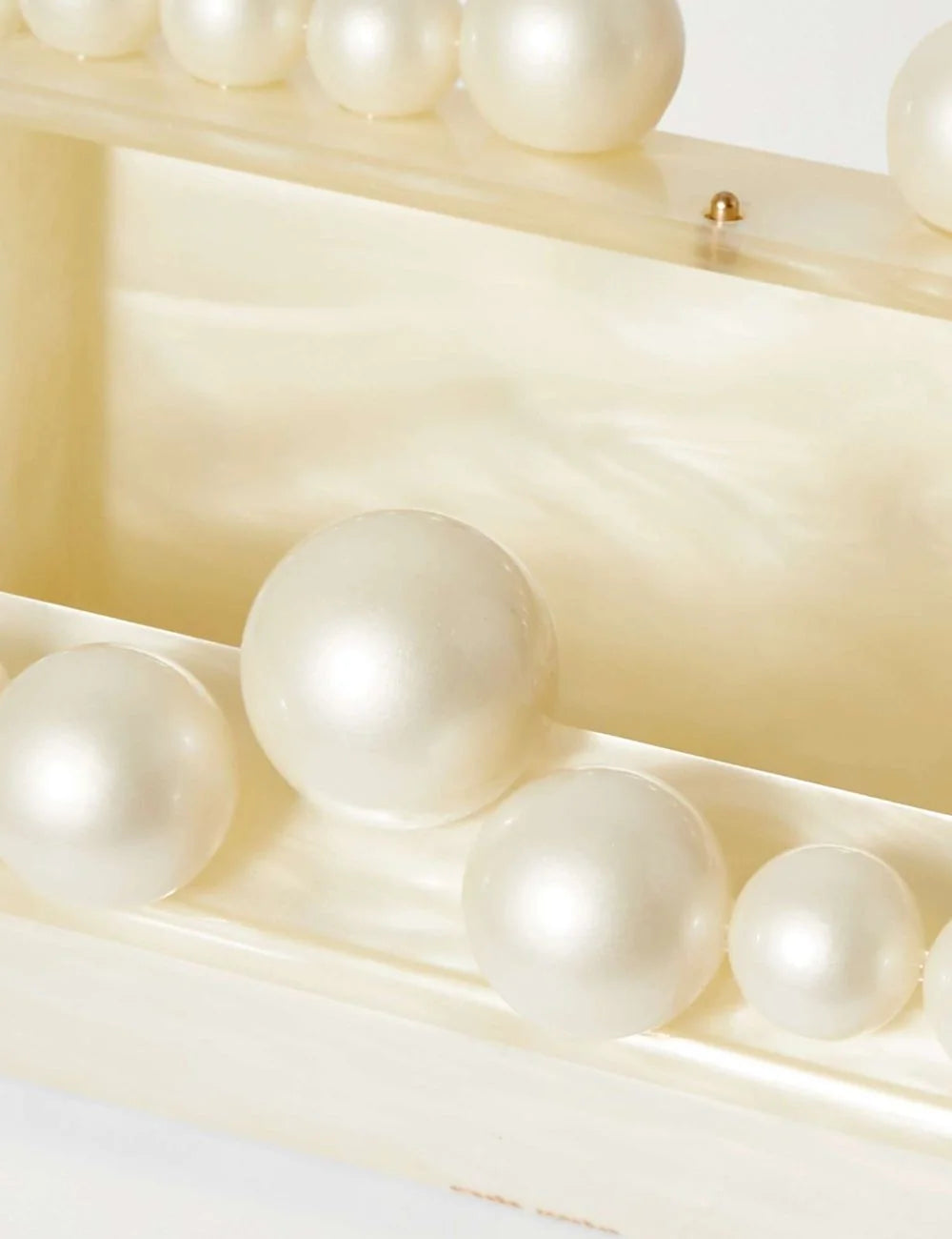 cult gaia pearl trim acrylic clutch ivory top view