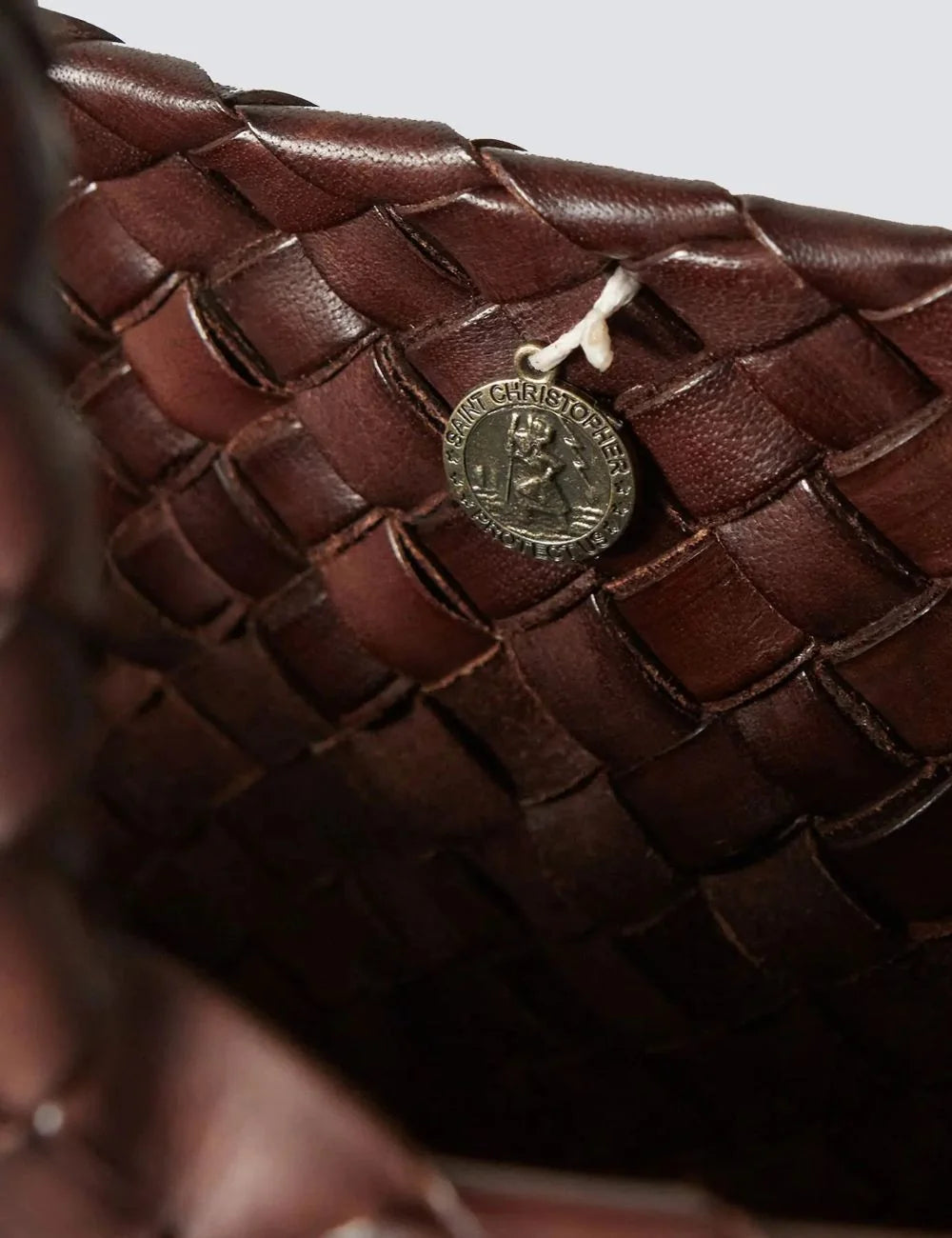 Dragon Diffusion dark brown woven leather basket bag with oversized shape close up logo view
