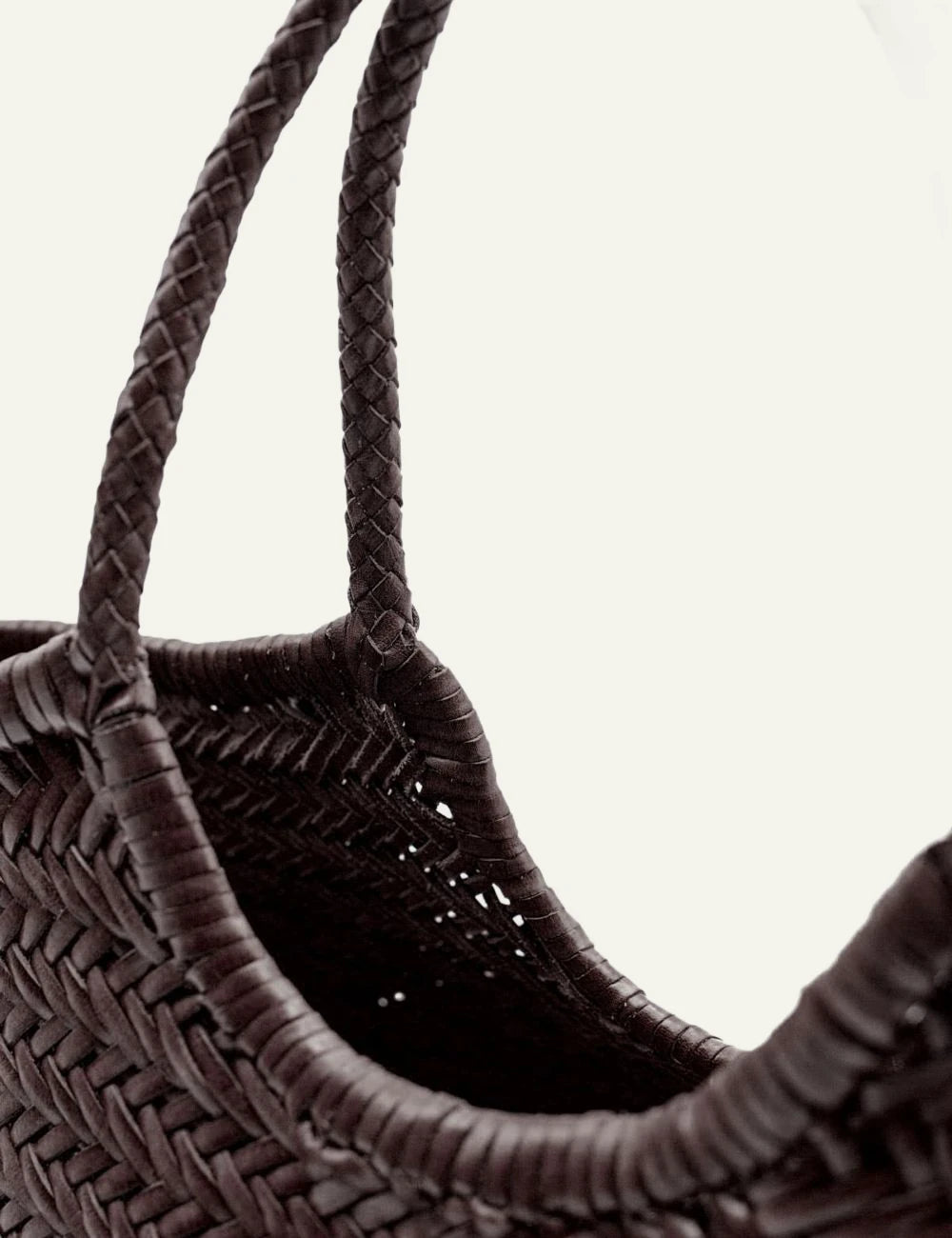 Dragon Diffusion woven leather tote bag in dark brown with braided handles close up view