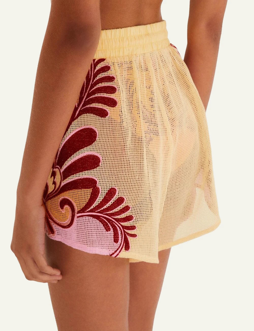 Farm Rio arabesque shorts soft yellow beach look worn back view