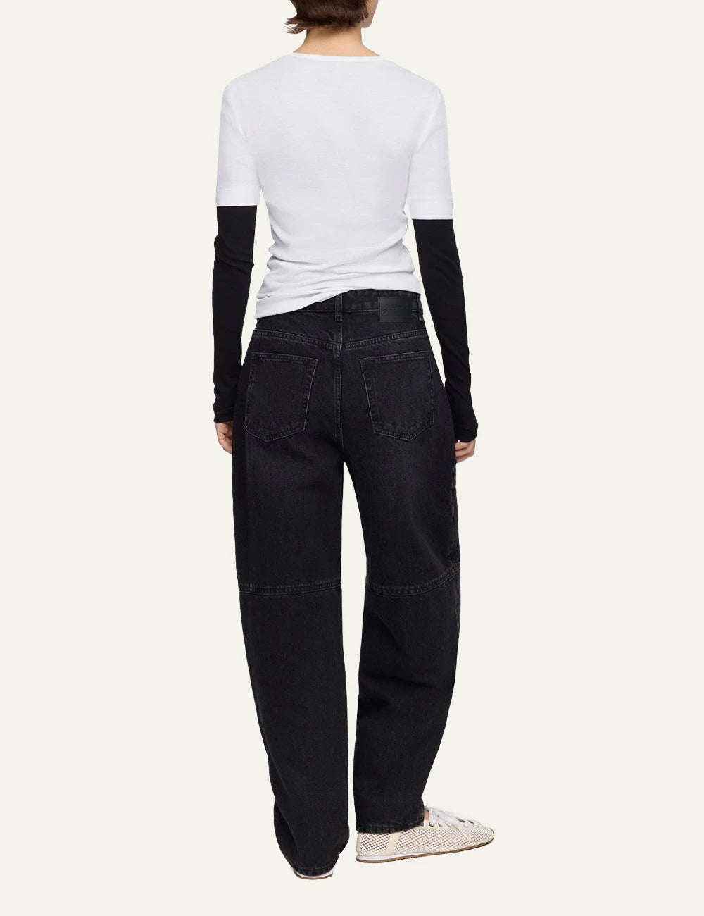 Ganni dark wash barrel leg denim jeans back view
