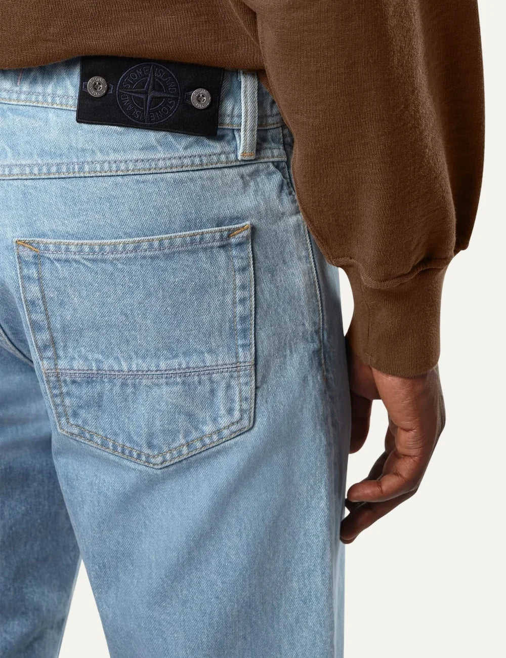 Stone Island men's light blue regular straight fit jeans with grainy stone-washed finish and classic five-pocket design back detail