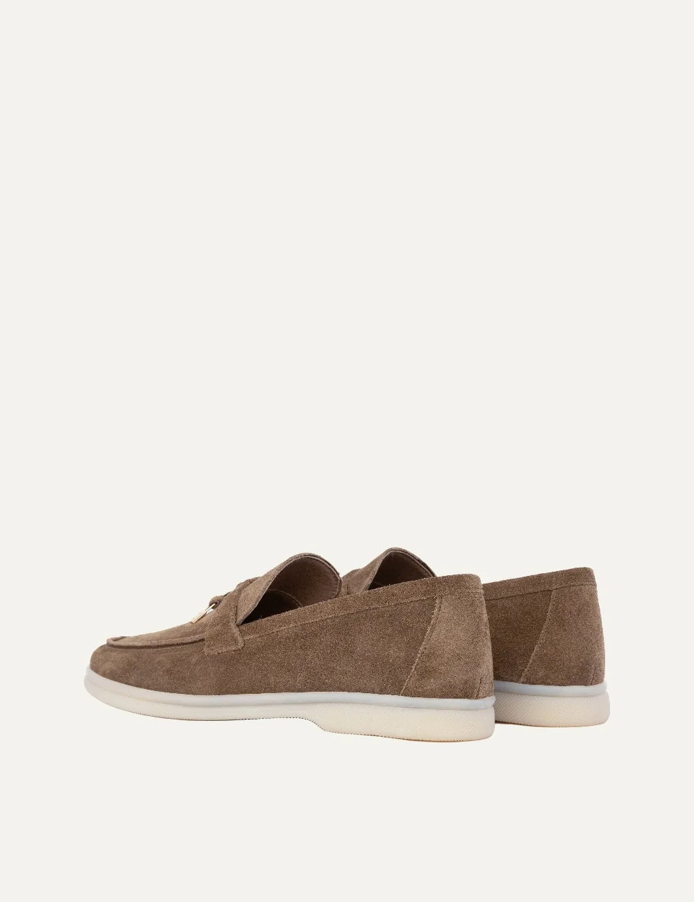 Komis & Komis men's taupe suede loafers with gold-tone metal detail and contrasting cream rubber sole, back view