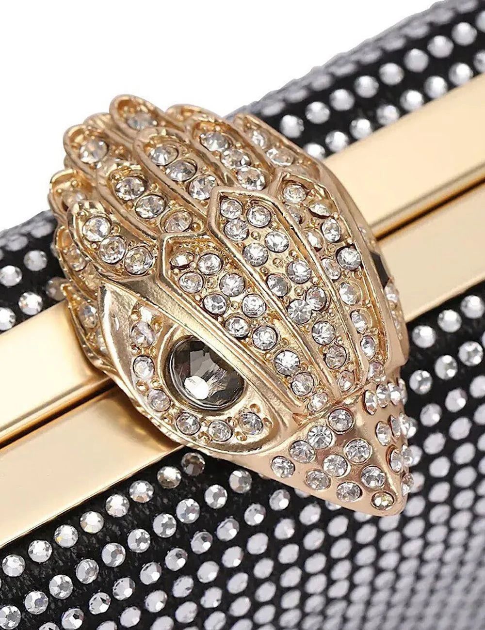 Kurt Geiger London eagle clasp detail gold hardware with crystals close up