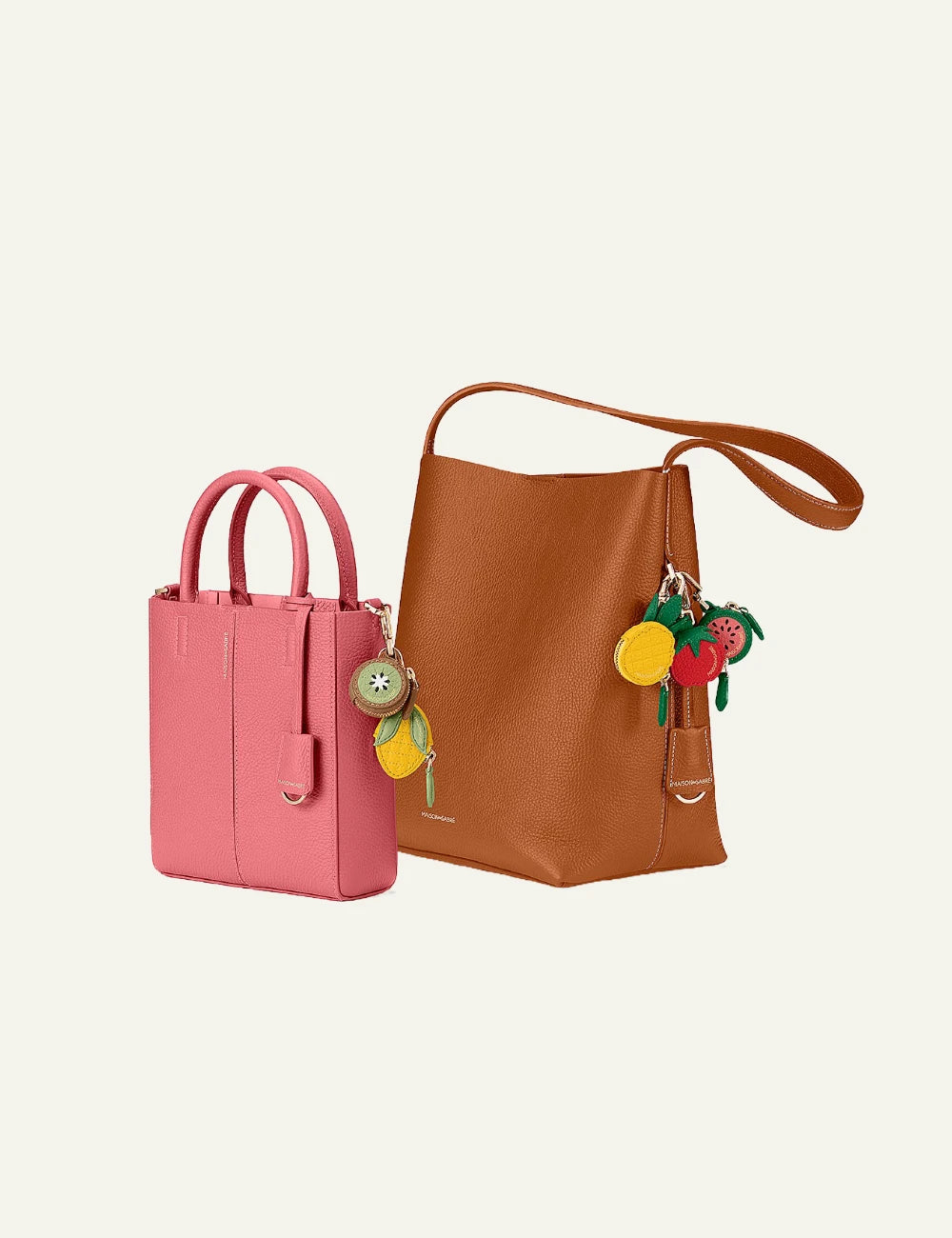 Maison de Sabre fruit charm strawberry leather AirTag case front detail view