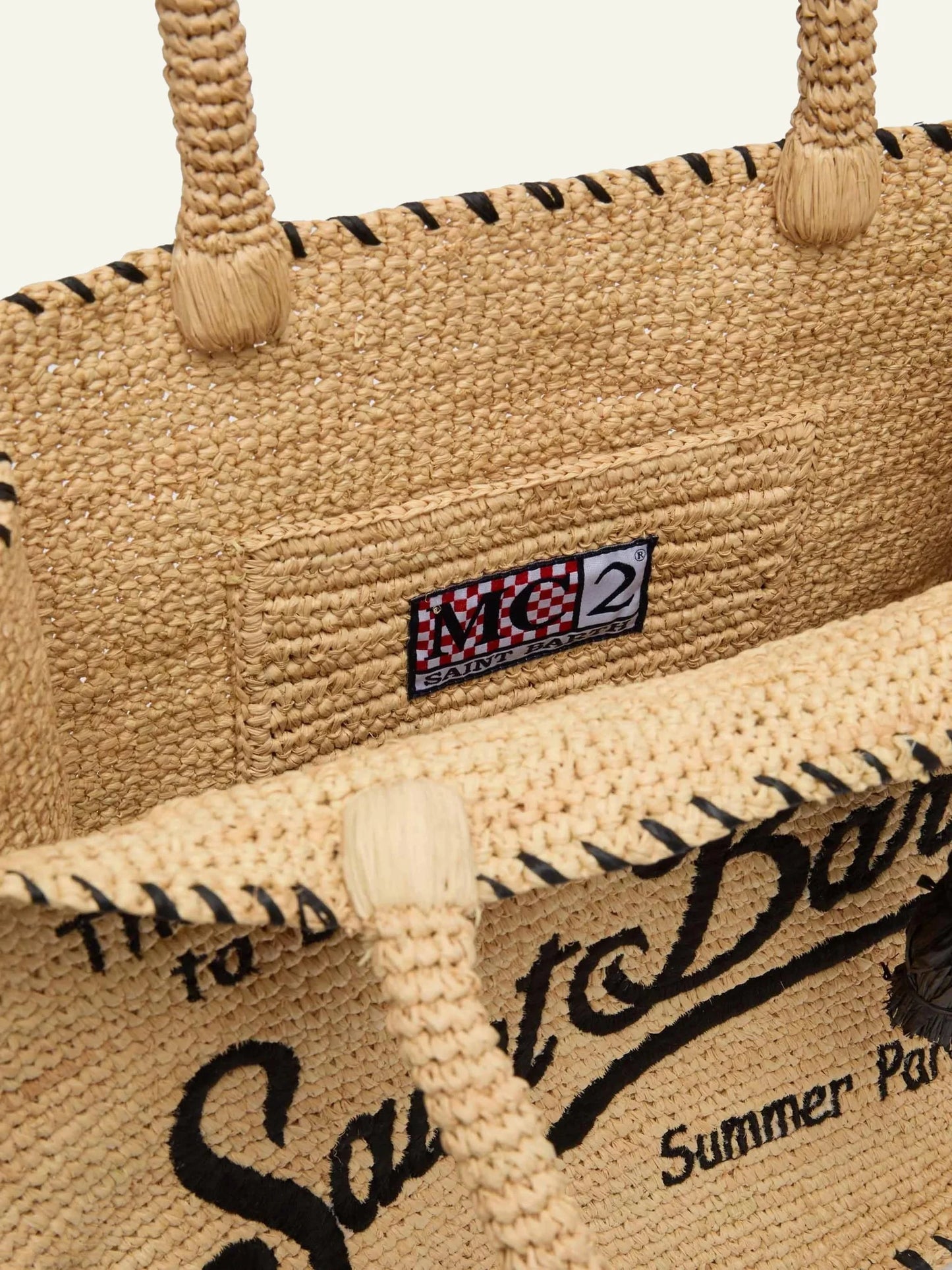 mc2 saint barth vanity raffia tote beige black embroidery tassel detail top view