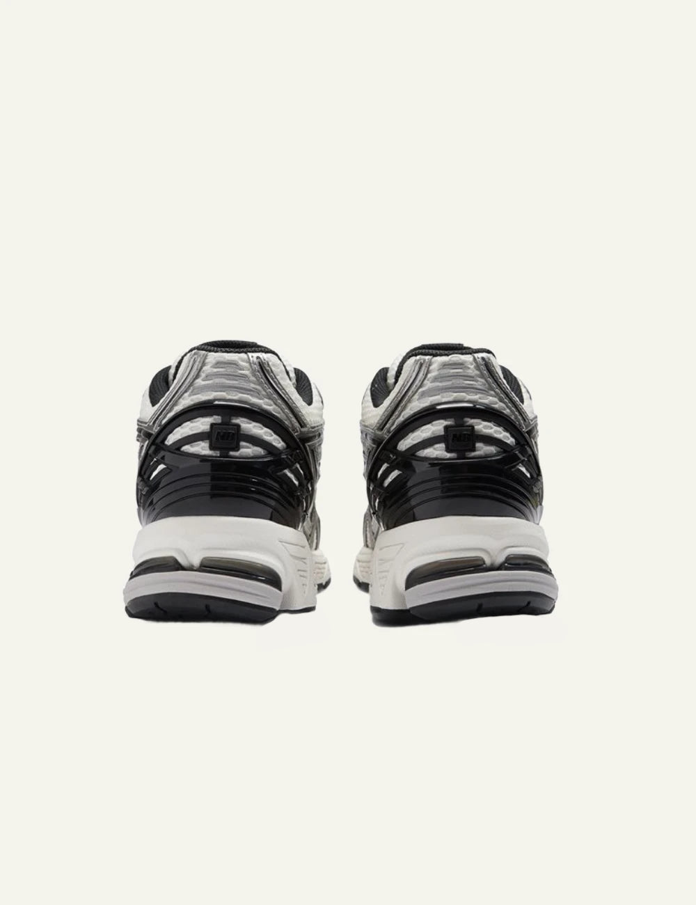 New Balance 1906R women's white mesh sneakers with silver and black details back view