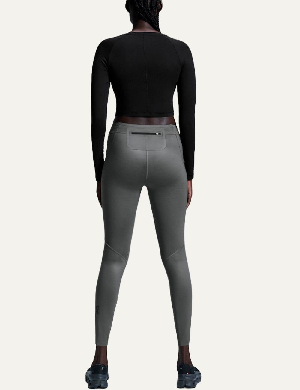 On black women's long sleeve crop training top back