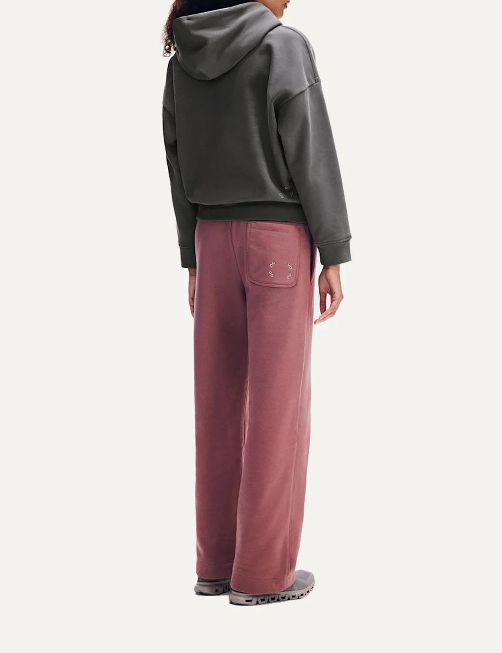 On women's grey zip-up hoodie with relaxed fit, drawstring hood, front pockets and embroidered logo side