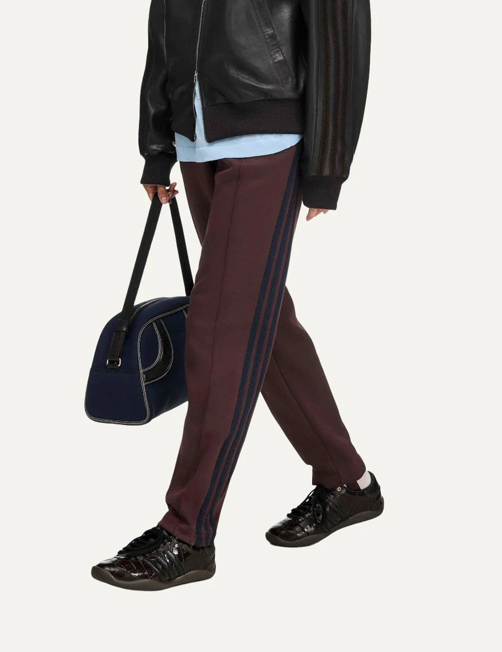 Women's Adidas Originals x Wales Bonner slim fit burgundy track pants with navy side stripes, Trefoil logo, front seams and stirrup hems, syling view