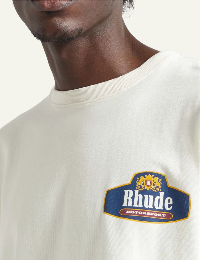 Rhude logo tee off white relaxed fit short sleeve chest logo close model view