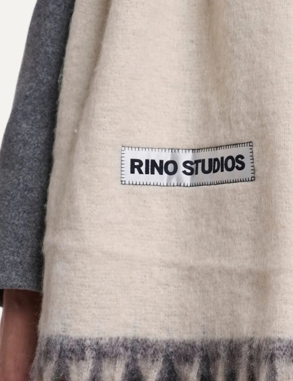 Rino Pelle women's oversized cream scarf with soft lime green accents, long fringes and Rino Studios logo patch detail