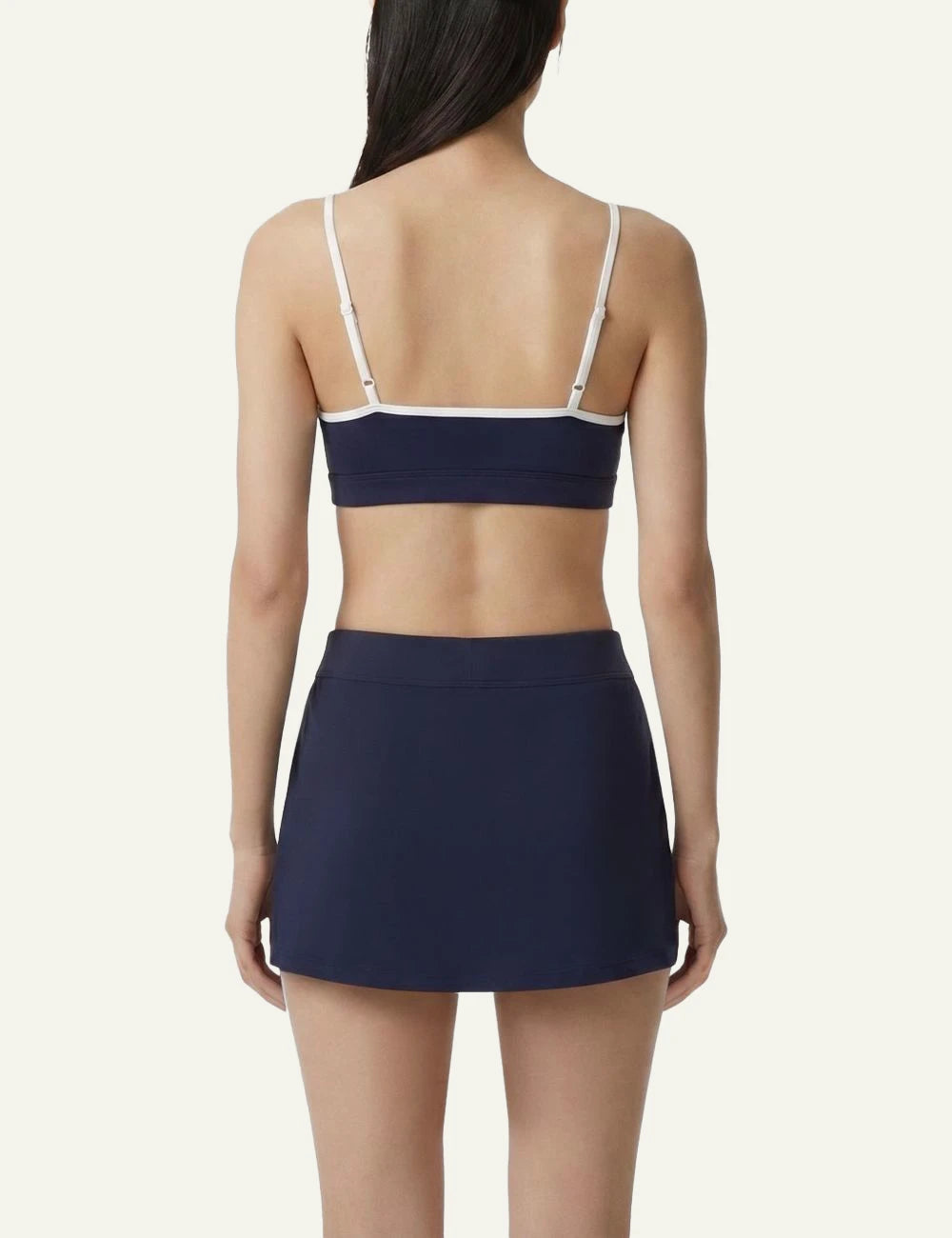 Sporty and Rich sports bra navy with white straps back view