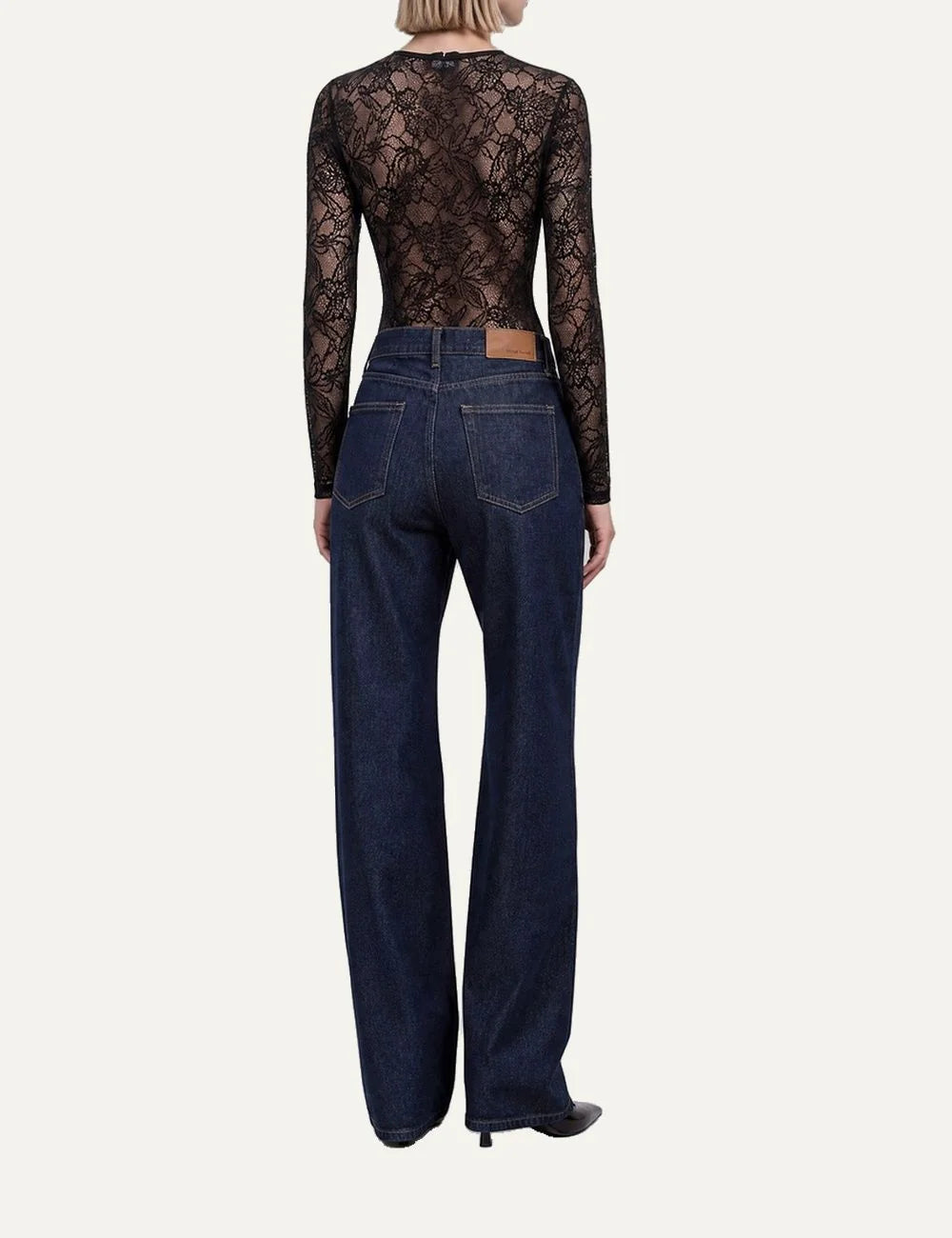 The Kooples women's black floral lace bodysuit with long sleeves, round neckline, sheer details, fitted silhouette and snap closure back