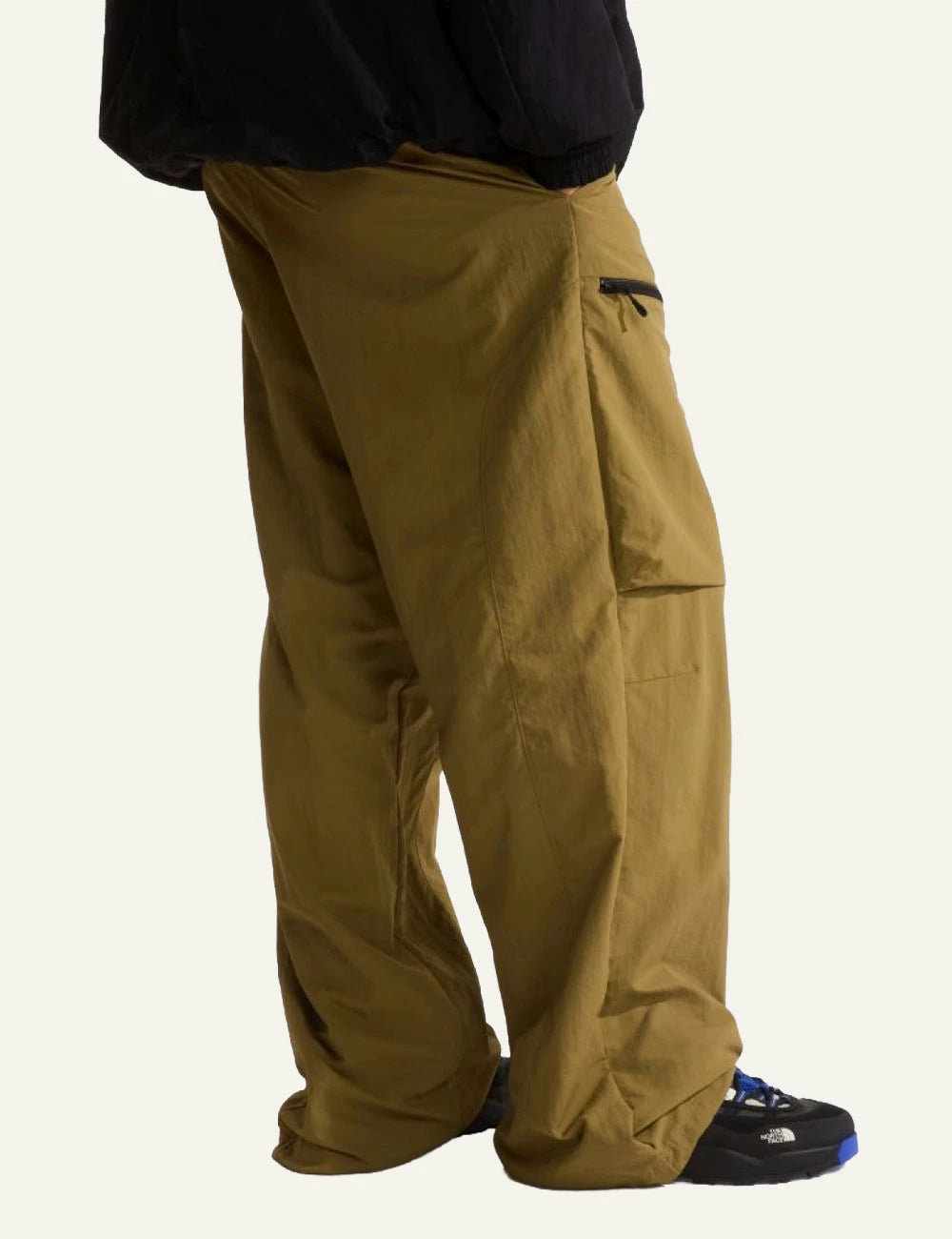 The North Face cargo nylon pants khaki relaxed fit zip pockets adjustable hem back view