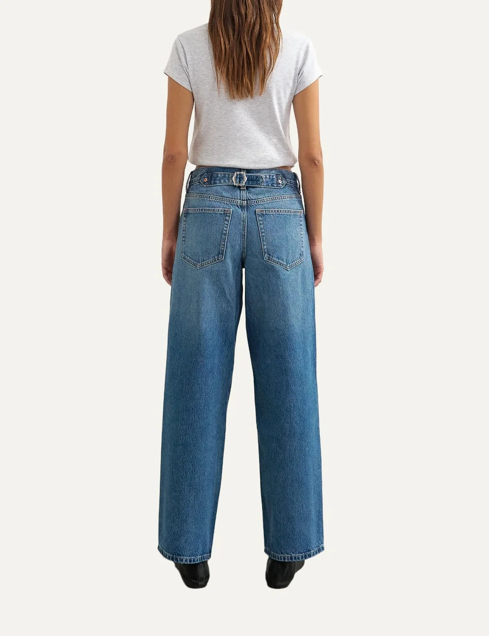 Topshop women's Cinch jeans in mid blue washed denim with a low-rise waist and relaxed straight legs back