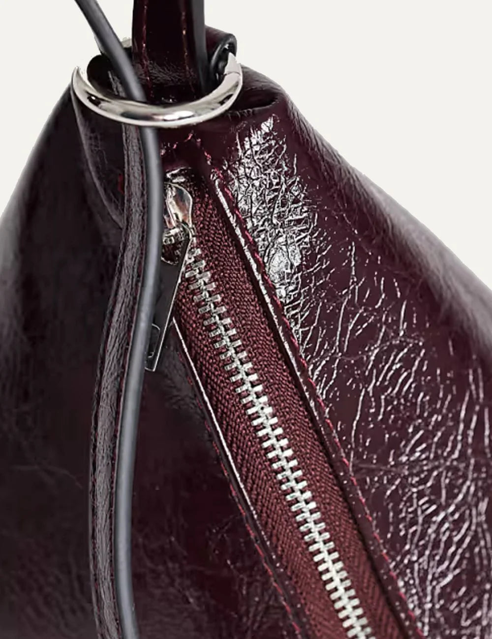 Topshop women's burgundy glossy crinkled triangular handbag with long strap and silver-tone side zipper top