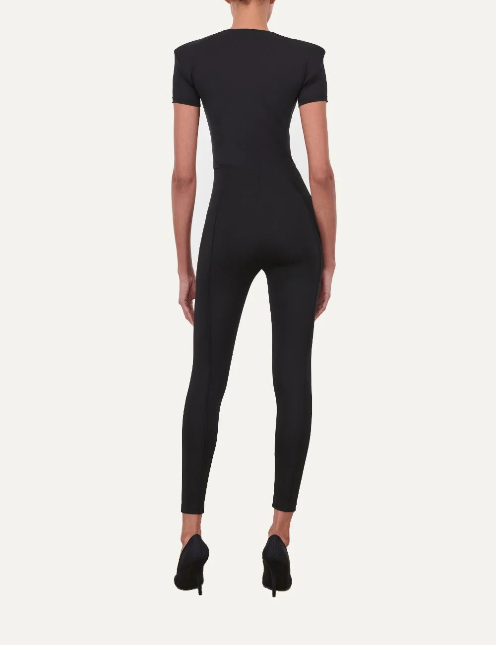 Wardrobe NYC women's black Bonded Legging in Italian technical stretch jersey featuring a high-rise bonded waistband, matte finish, slim fit and front and back pintuck seams back