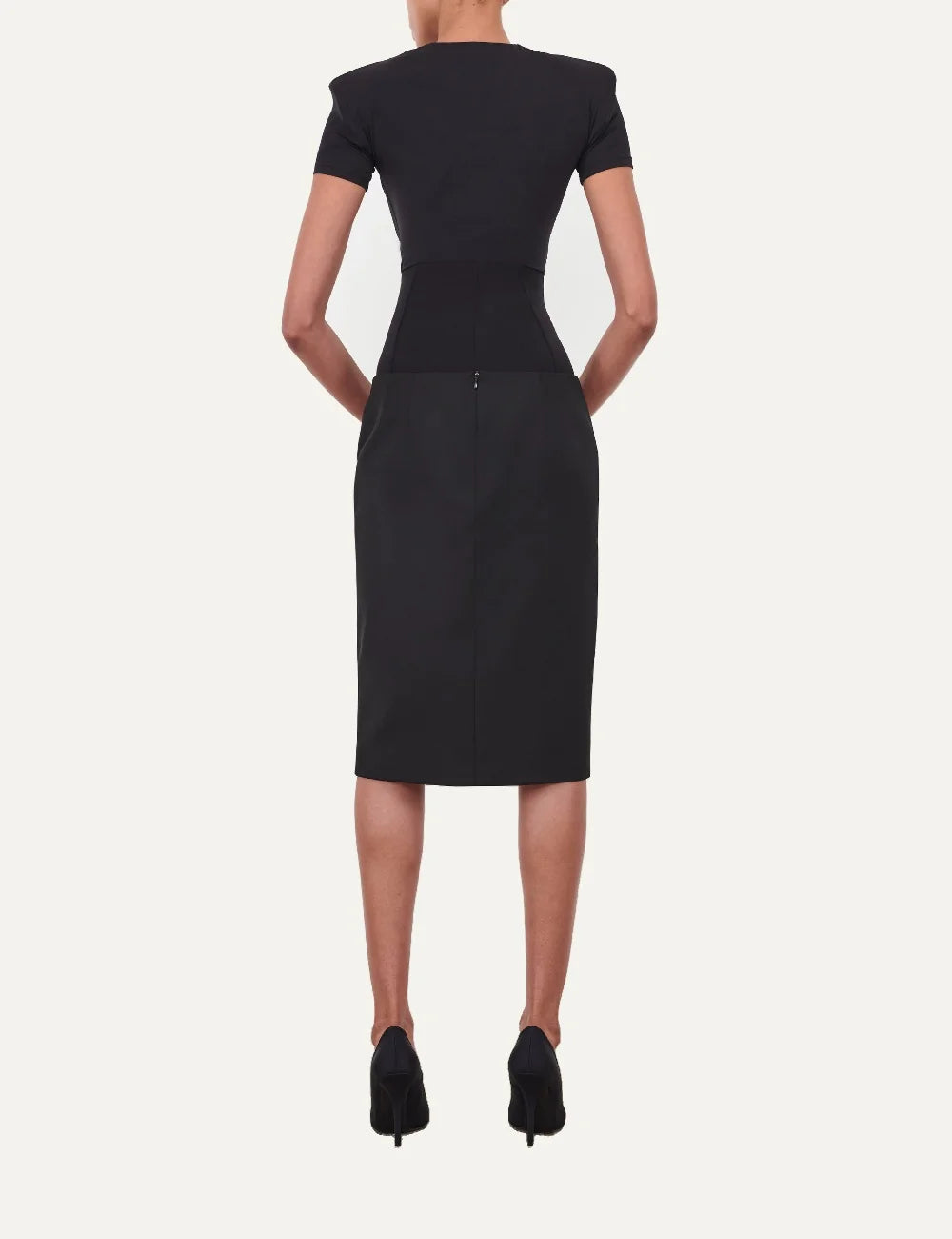 Wardrobe NYC women's Blade Cap Sleeve Bodysuit in black Italian stretch jersey with short sleeves, padded shoulders, round neckline and fitted silhouette back