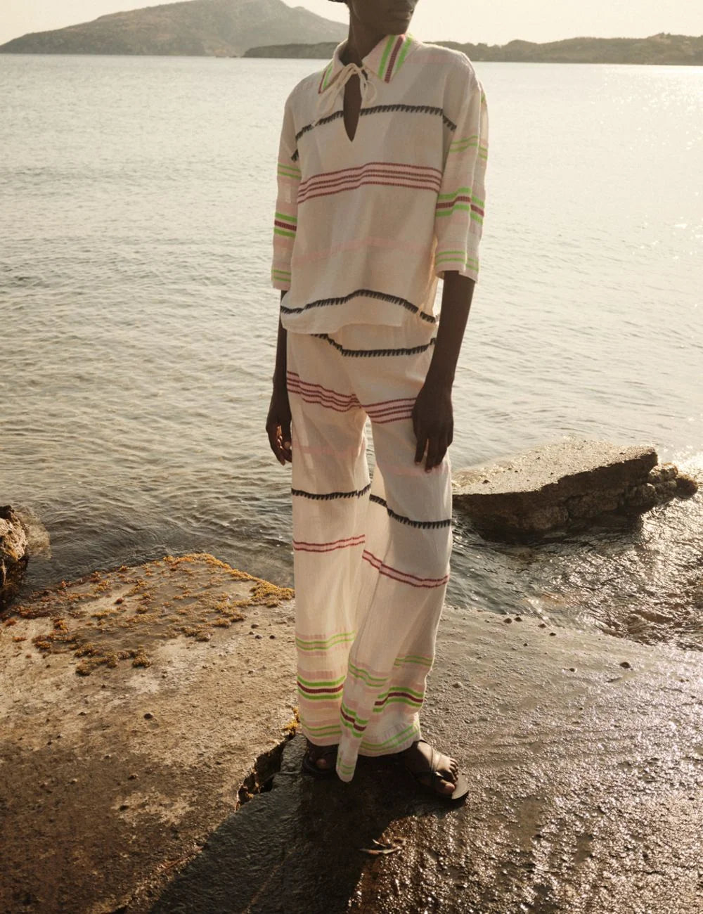 Sleeveless striped top wide leg pants coastal outfit