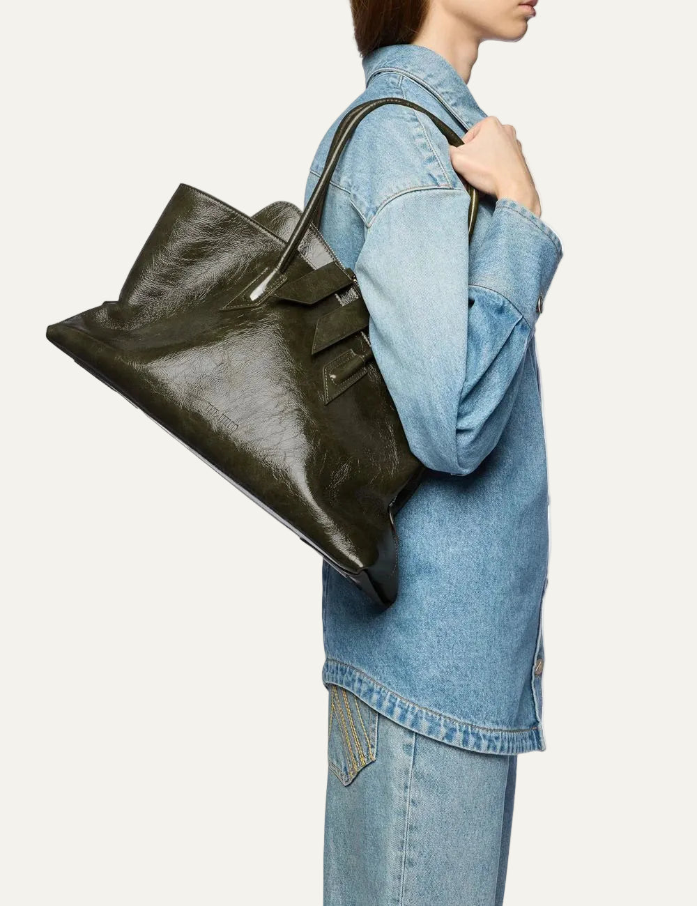 The Attico La Passeggiata Medium olive brown patent leather top handle bag for women on model