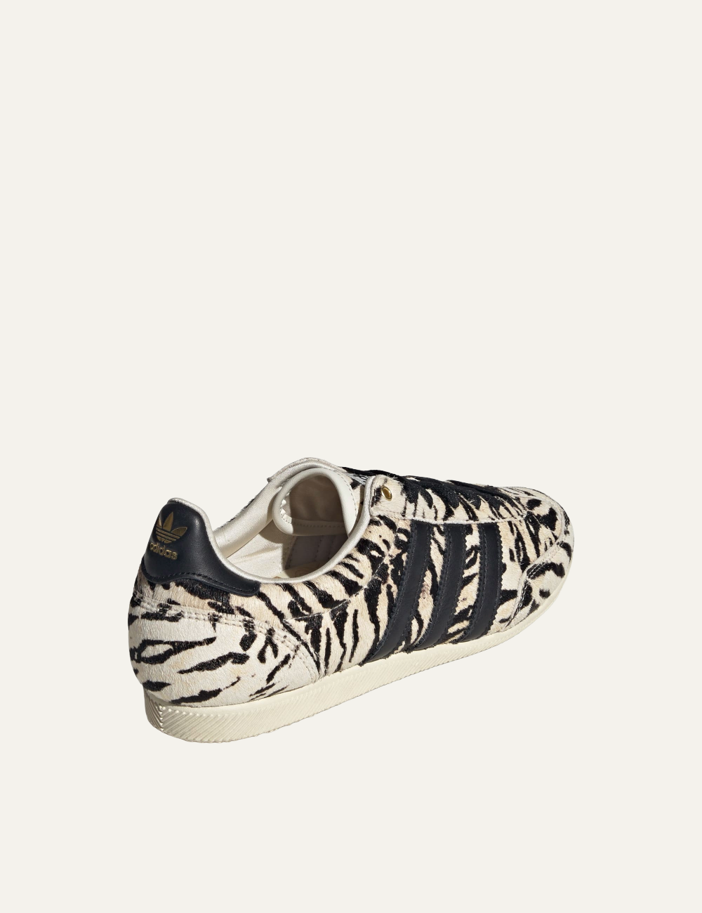 Women’s Adidas Japan W pony-hair sneakers with beige and black animal print and signature three stripes back side view
