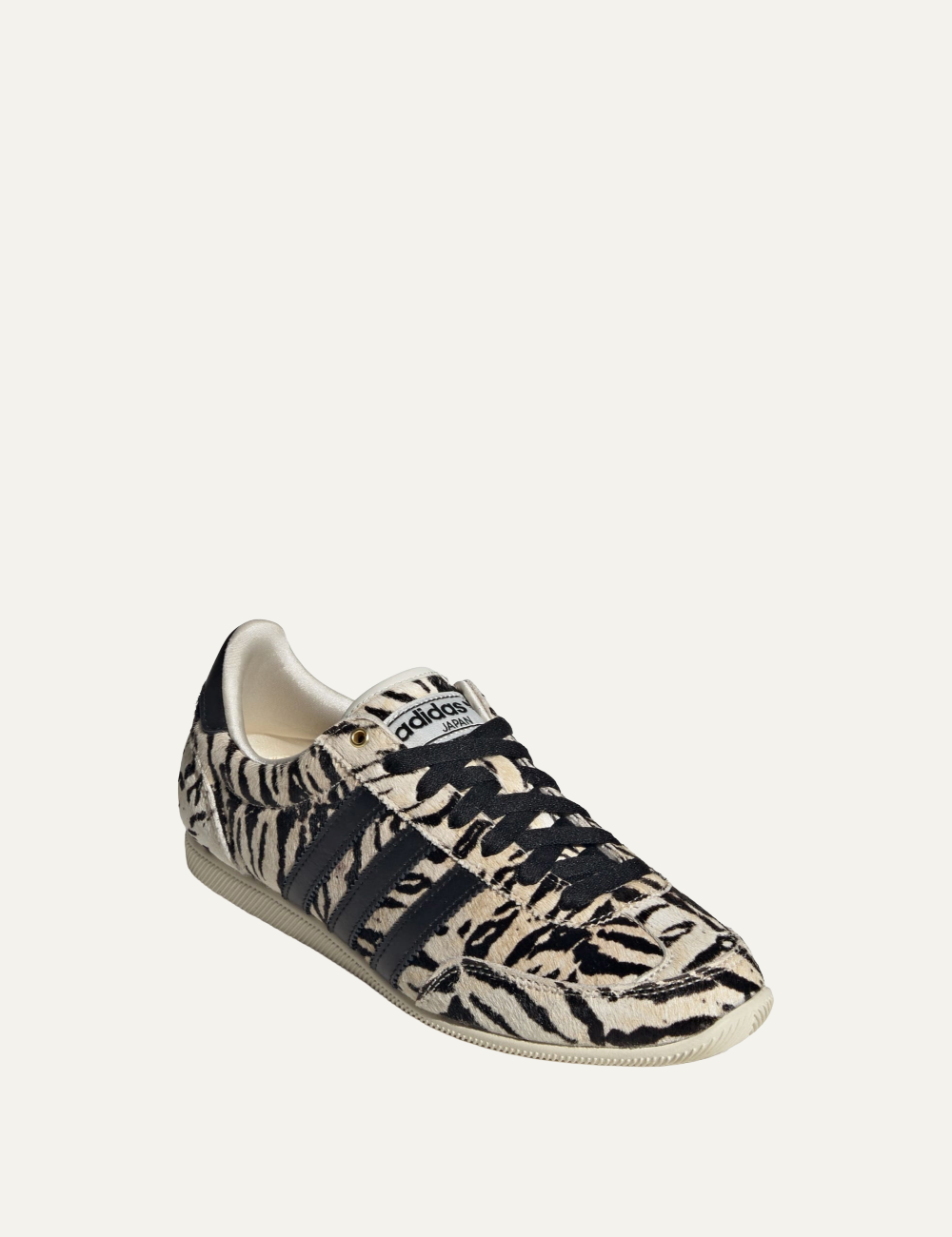 Women’s Adidas Japan W pony-hair sneakers with beige and black animal print and signature three stripes front side view