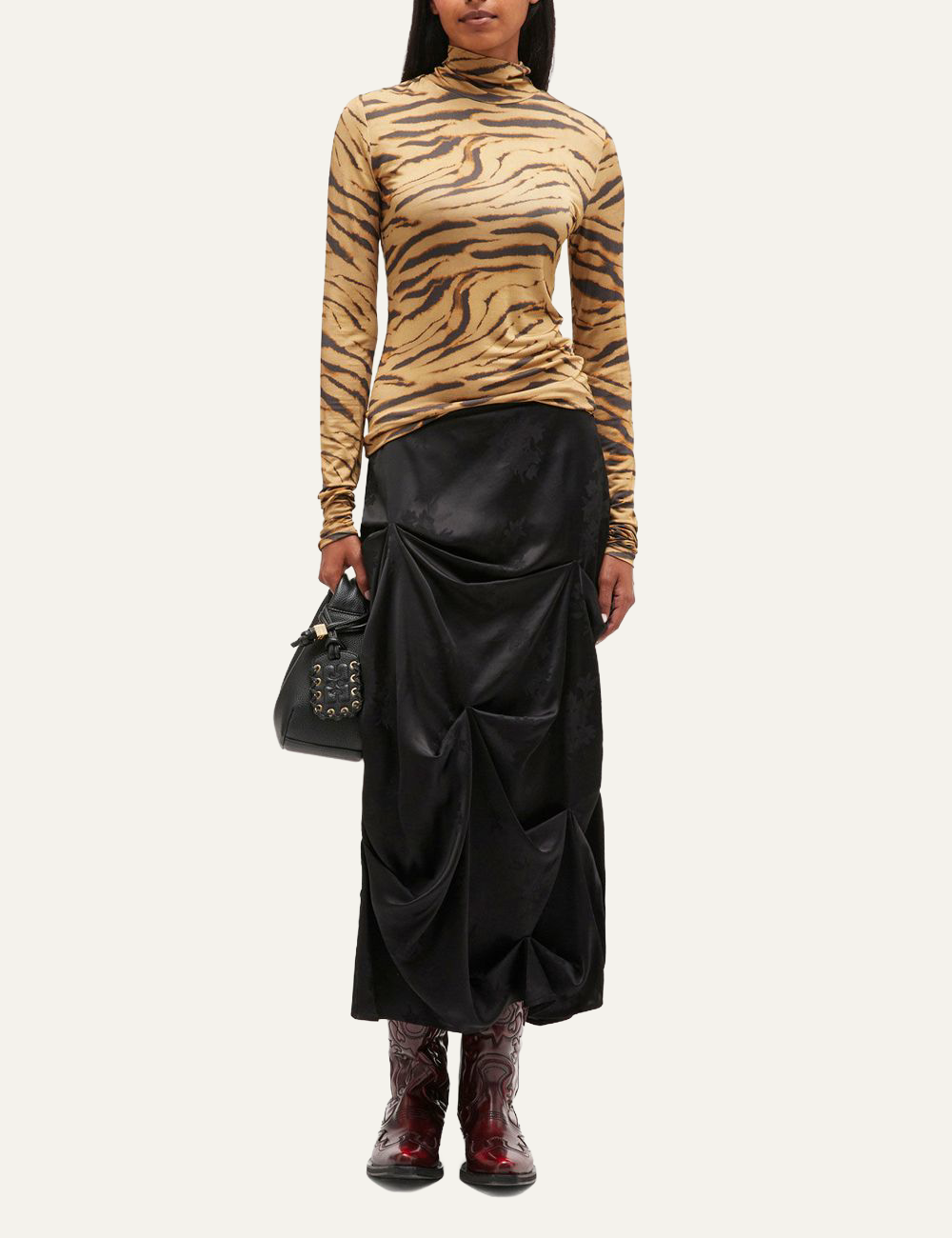 Full-body view featuring beige Ganni tiger print turtleneck top.
