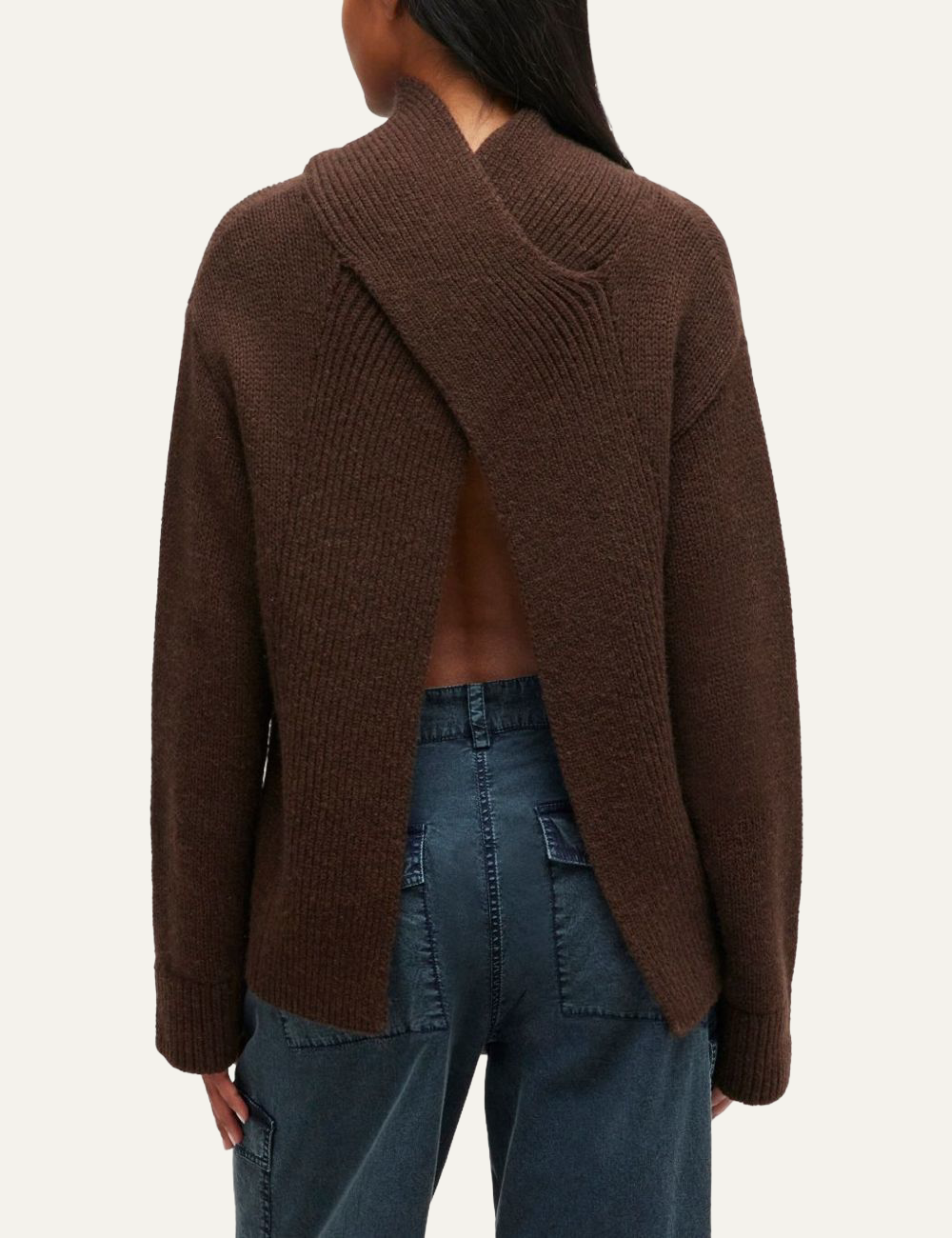 Brown Ganni knitted sweater featuring an open-back crossover design.