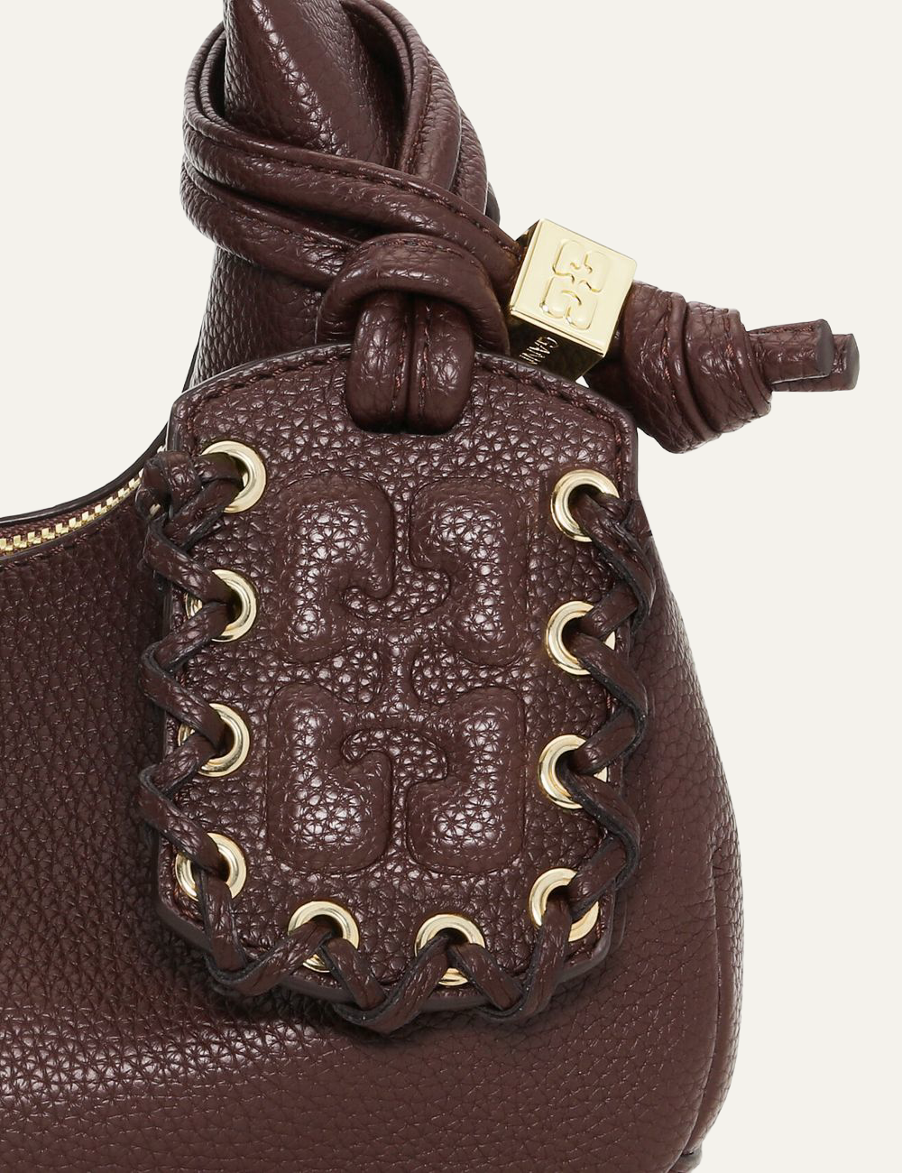 Close-up of Ganni Hobo Mini bag detailing and stitching.