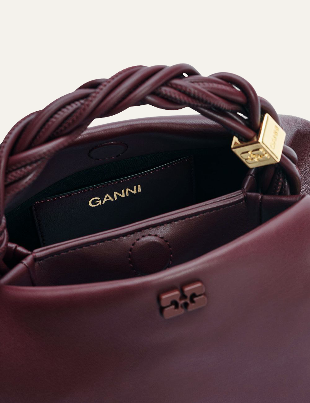 Back view of small burgundy Ganni Bou Bag with twisted handle