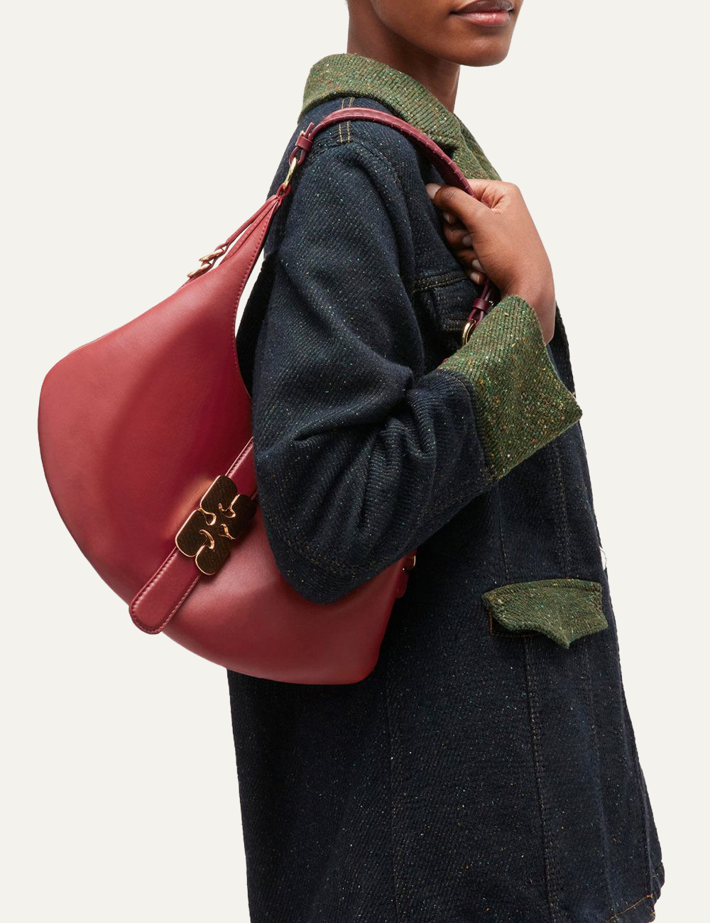 ganni kat small gold red dahlia bag with butterfly clasp held by model