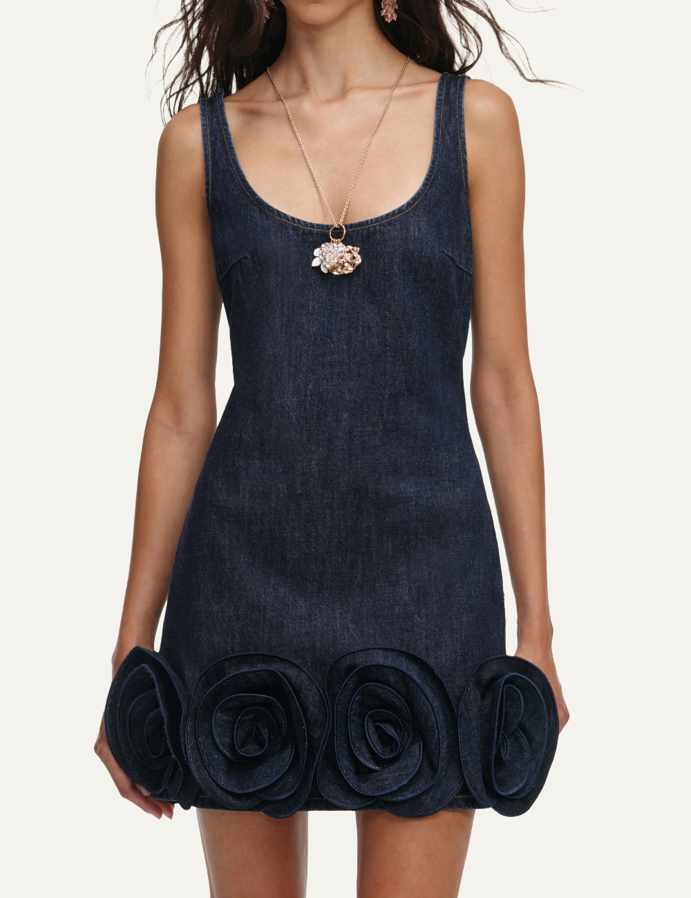 Dark blue denim mini dress with 3D rosette details along the hem.
