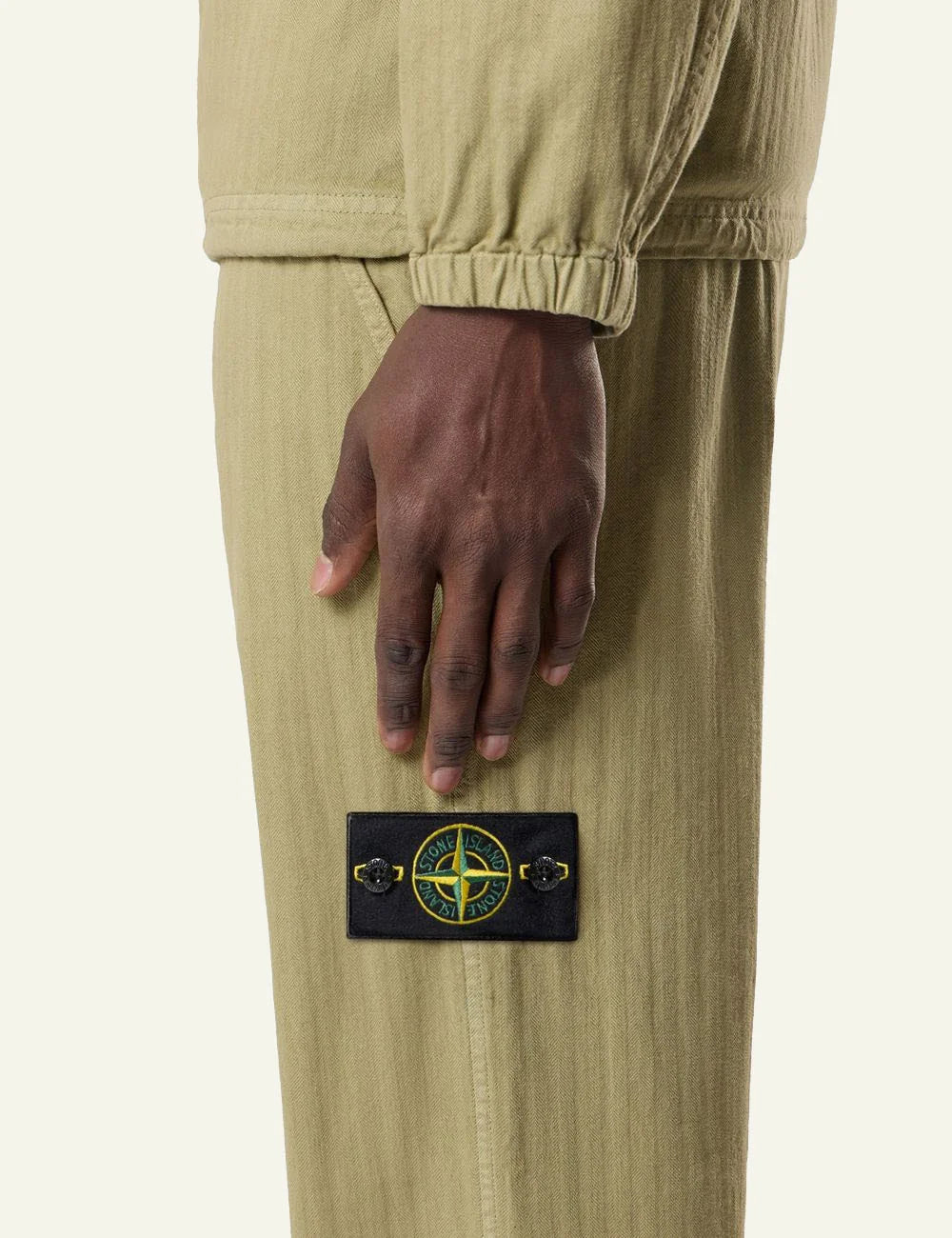Men's Stone Island olive cotton herringbone chino trousers with Compass logo patch side