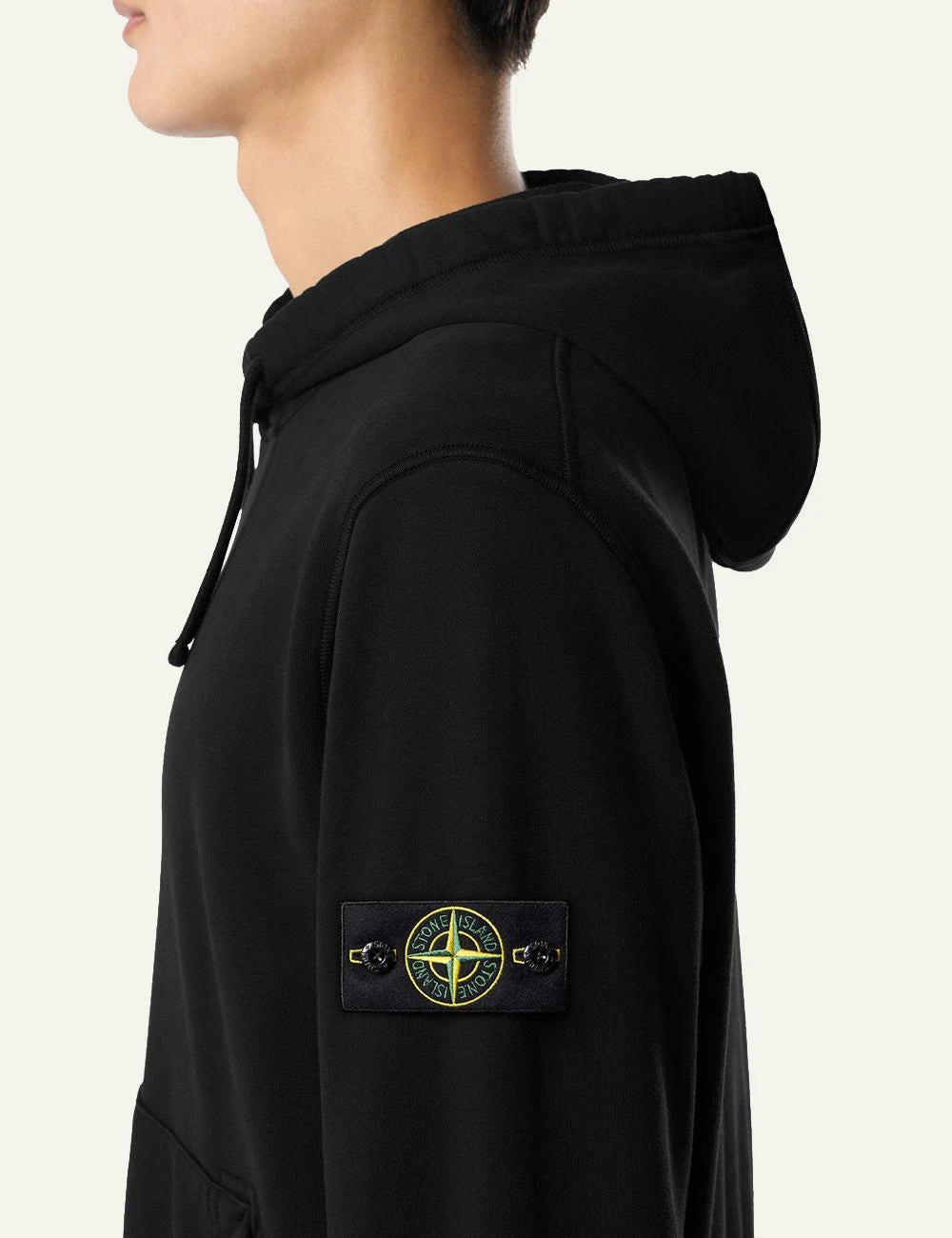 Men's Stone Island organic cotton fleece hoodie in black with sleeve logo patch and kangaroo pocket side