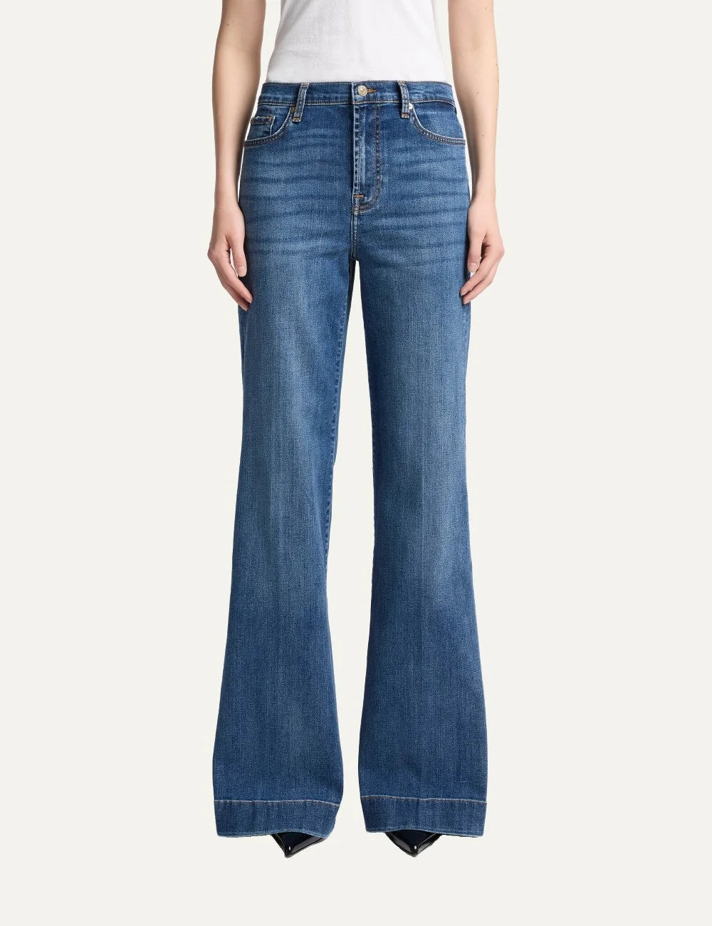 7 For All Mankind women light wash high-rise wide flare jeans with subtle whiskering and faded details model