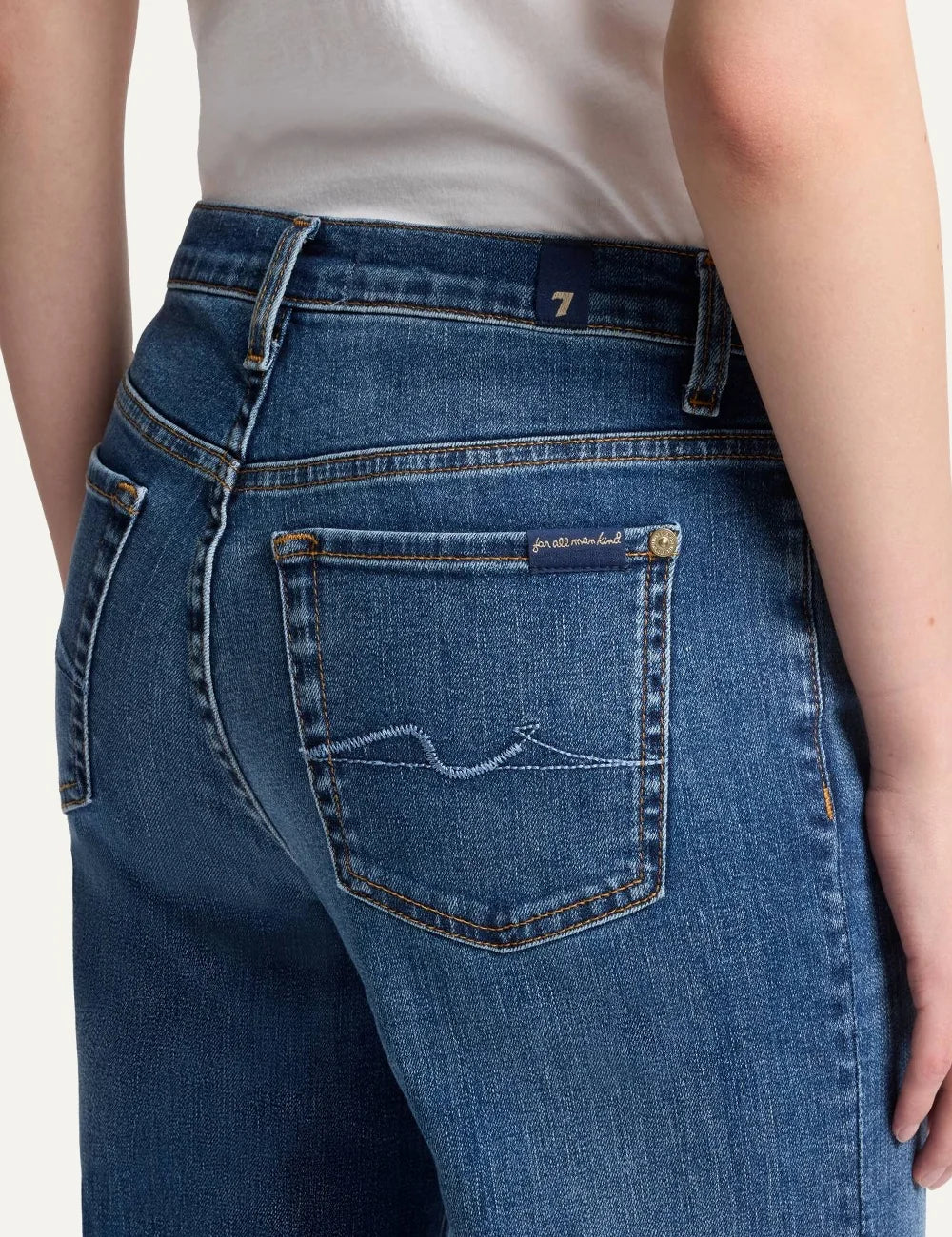 7 For All Mankind women light wash high-rise wide flare jeans with subtle whiskering and faded details back detail