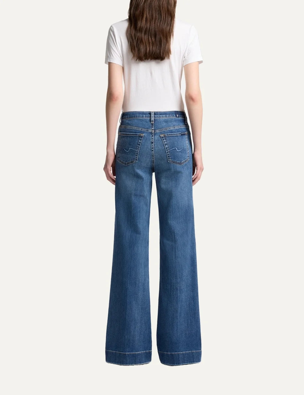 7 For All Mankind women light wash high-rise wide flare jeans with subtle whiskering and faded details back