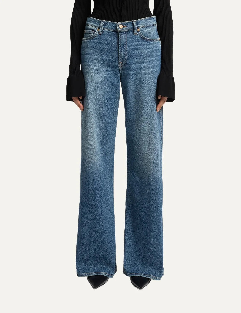 7 For All Mankind women medium wash high-rise wide-leg jeans with subtle whiskering and faded details model