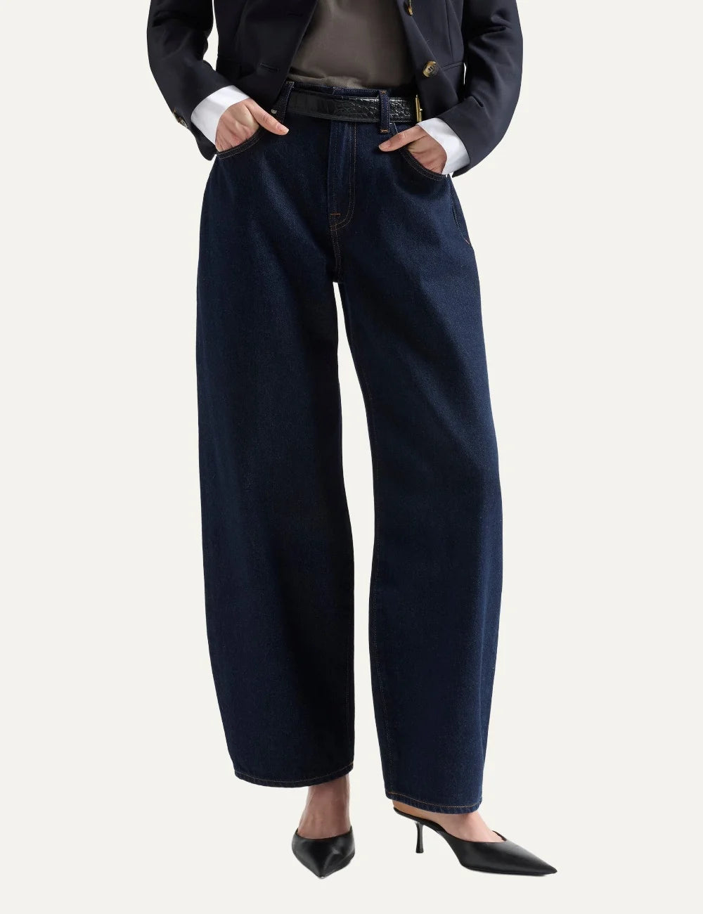 7 For All Mankind women dark wash mid-rise barrel-leg jeans with relaxed fit and contrast stitching model